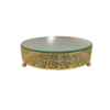 Ornate round cake stand with intricate gold design on the 2.5 inch edge. Small ball feet. Mirror top.