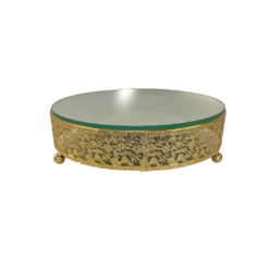 Ornate round cake stand with intricate gold design on the 2.5 inch edge. Small ball feet. Mirror top.