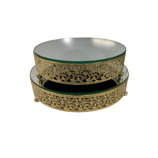 Two ornate gold cake stands with mirror tops stacked. 10 inch diameter on top and 12 inch on bottom.