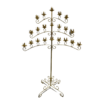 Gold floor standing candelabra with 3 wide symmetrical arms. Bottom arm has 4 spots of candles on both the right and the left side of the post, middle arm has 3 and the top arm has two.