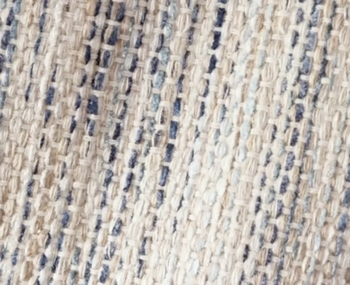 Close up on rug - shades of tan, blue woven together