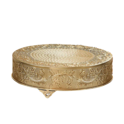 Round gold metal cake stand with ornate pattern