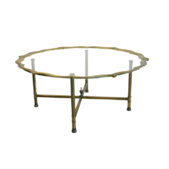 Brass coffee table with Hollywood Regency scallops edge and glass top. 4 brass legs.