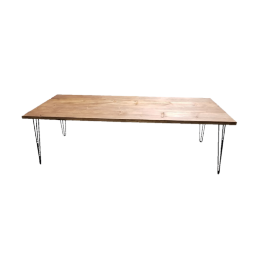 Wooden farm table with medium stain. Black metal hairpin legs on each corner.