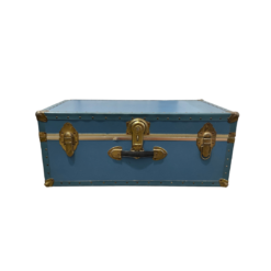 Vintage blue trunk facing front with brass locks on either side and a lock in the middle. Handle under the main lock.