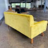 Back of yellow velvet sofa