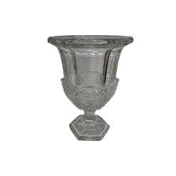 Glass cut, crystal vase with a pedestal foot in a hexagon. Detail cut out on the bottom half of the vase.