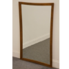 Wooden framed mirror with slight lifted corners.