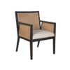 Dark wooden chair with strong angles. Cane on back and arms. Cream upholstered seat.