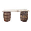 Vintage barrels with a white door on top creating a table