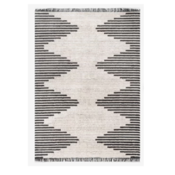 Large gray and beige rug with alternating stripes that create beige diamonds down the middle with gray triangles on the sides.
