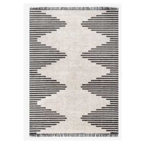 Large gray and beige rug with alternating stripes that create beige diamonds down the middle with gray triangles on the sides.