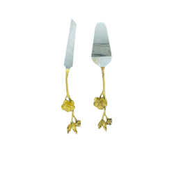 Gold handled serving set with ornate florals.