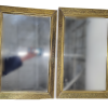 set of two rectangular mirrored trays. Thick gold trim.