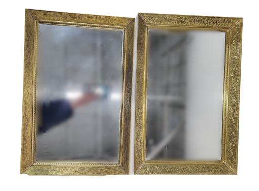set of two rectangular mirrored trays. Thick gold trim.