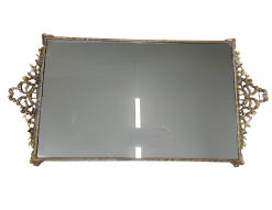 Rectangle mirrored tray with gold trim.