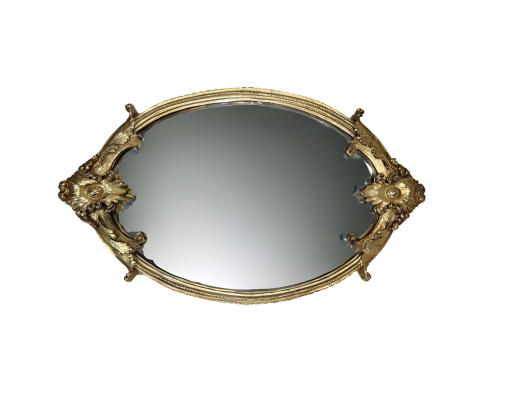 Top view of mirror tray with intricate gold trim.