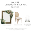 A giant standing picture frame as a backdrop, once upholstered oval chair, and a set of clear cylinder candle votives.