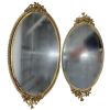 Set of oval shaped mirrored trays.