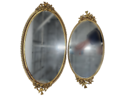 Set of oval shaped mirrored trays.